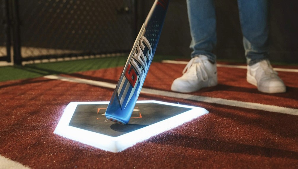 Batter tapping HitTrax Suite Smart Plate