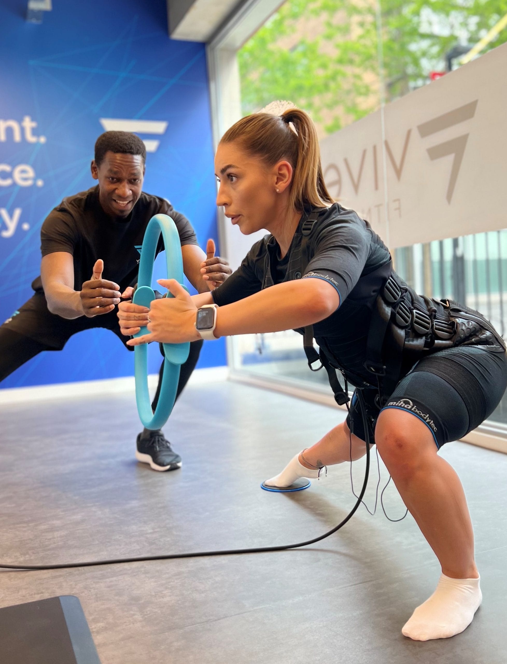 woman in black sports bra and black leggings doing exercise