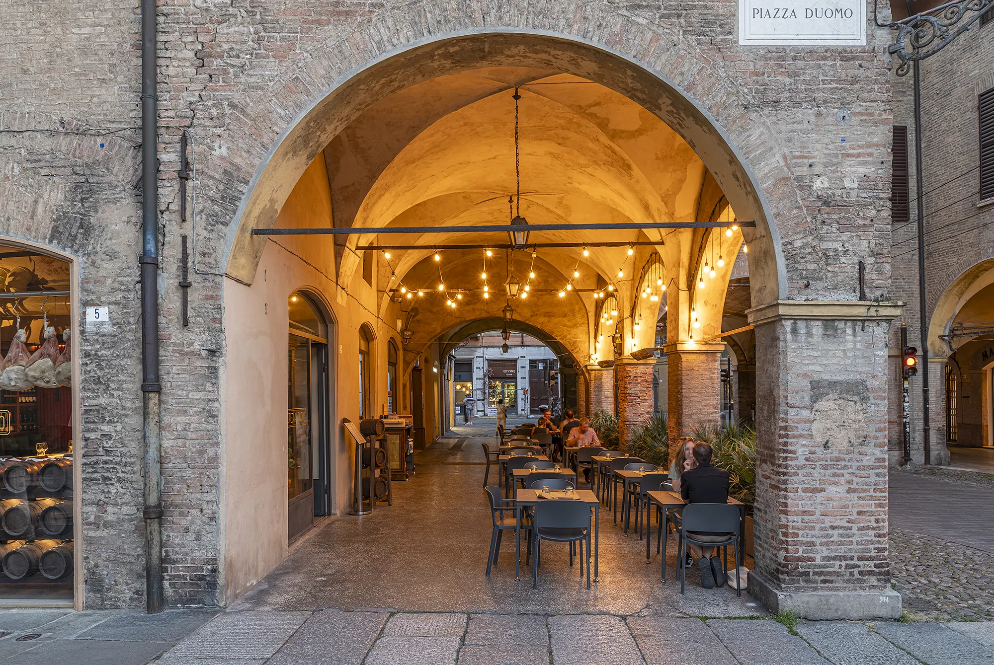 Classic restaurant interior at Enoteca Al Duomo in Piazza Grande