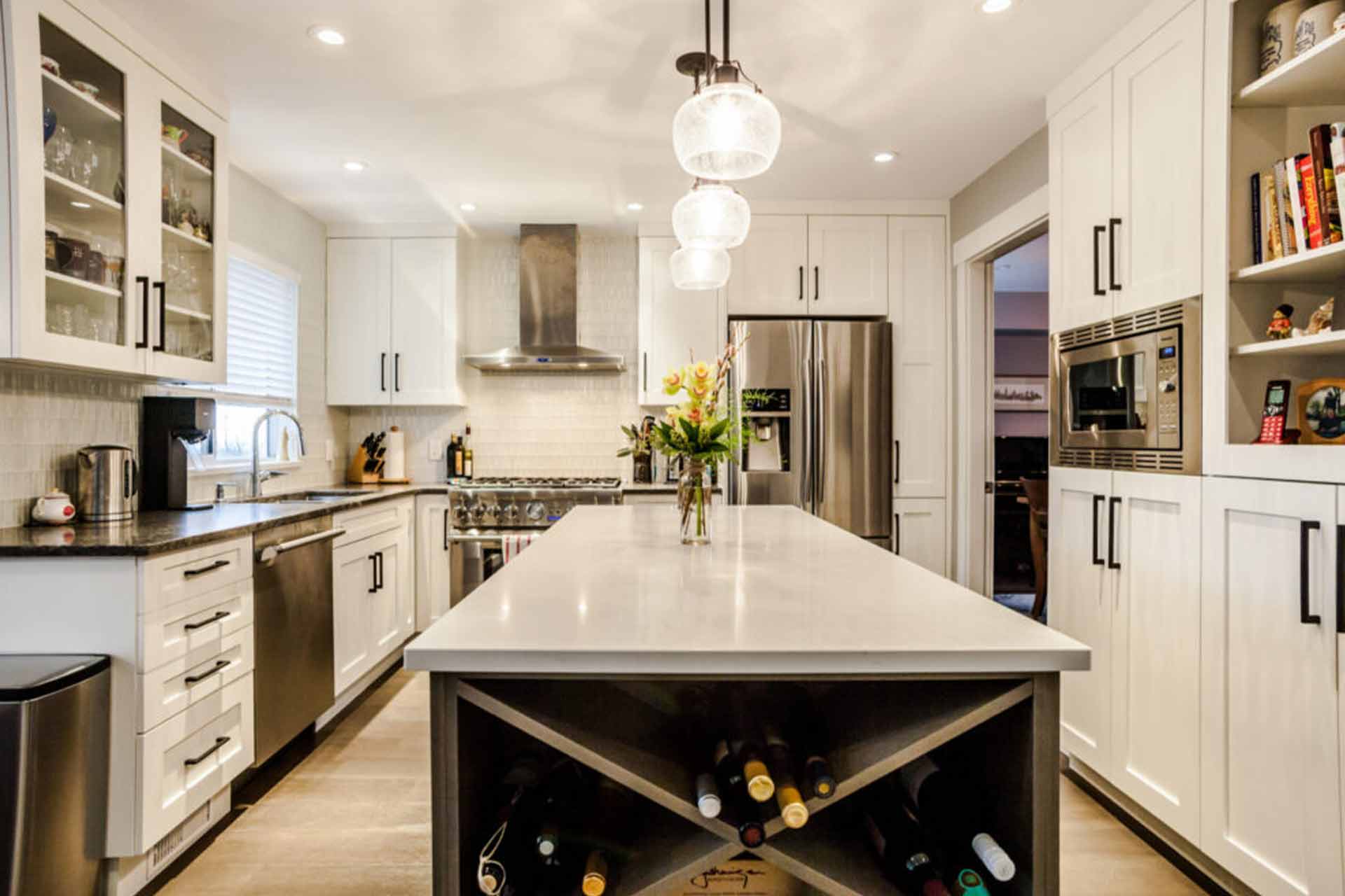 warm lighting kitchen white cabinets wine rack in eagle ridge