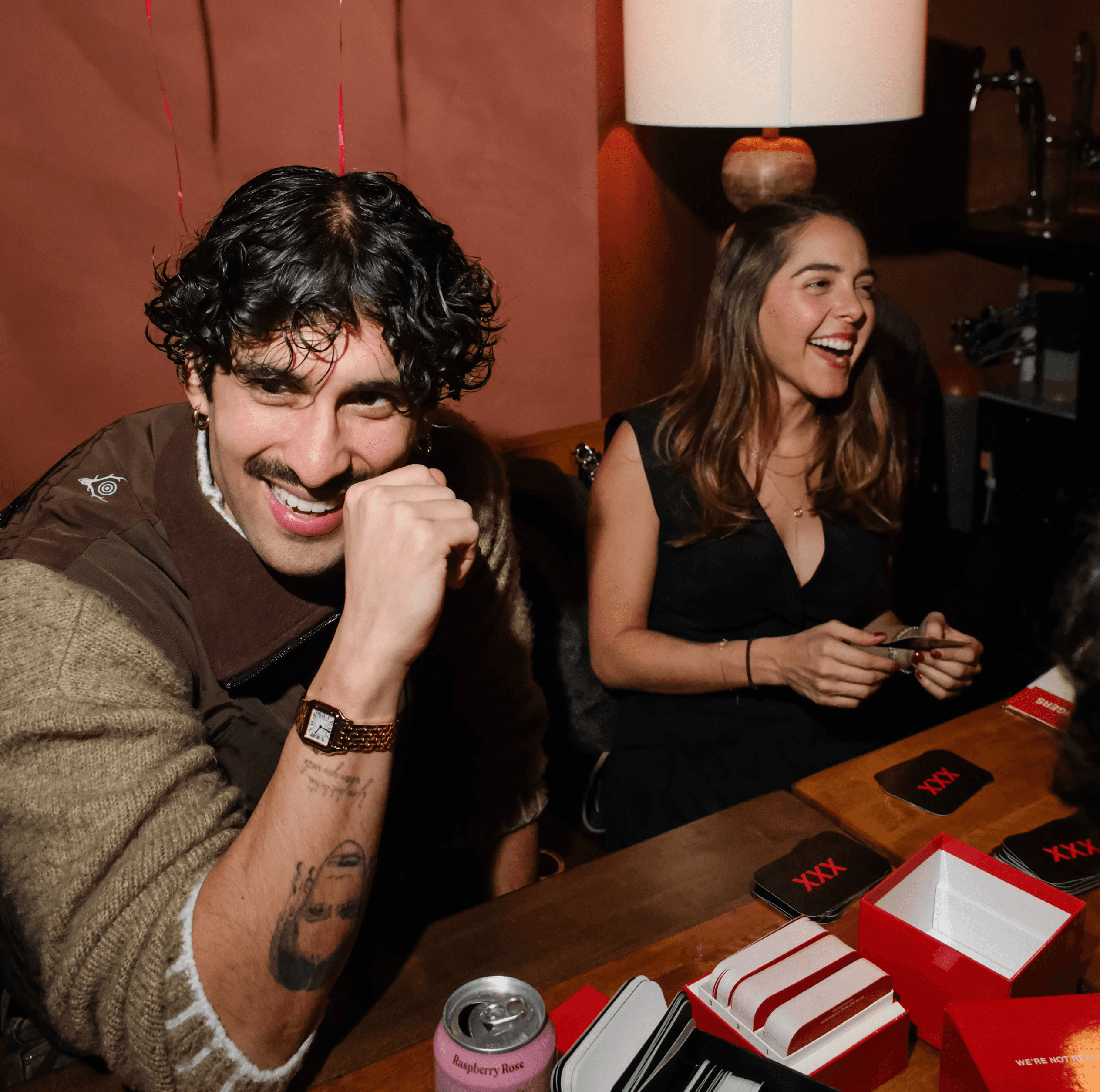 Guests at singles event playing icebreaker game during IRL dating night