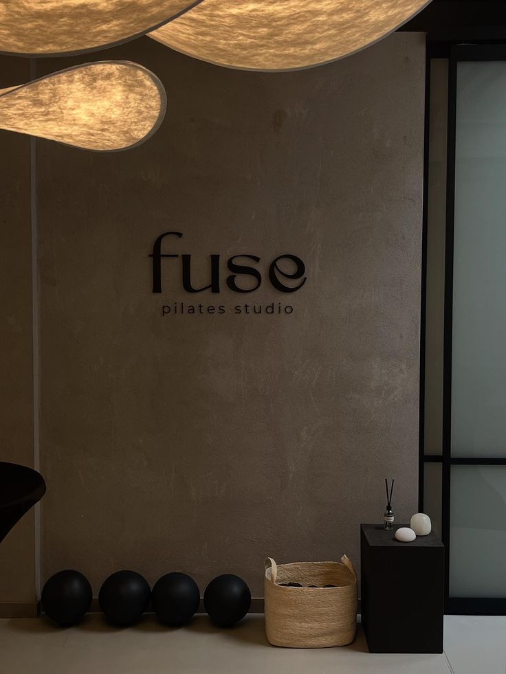 Metal Sign called Fuse Pilates Studio in reception 