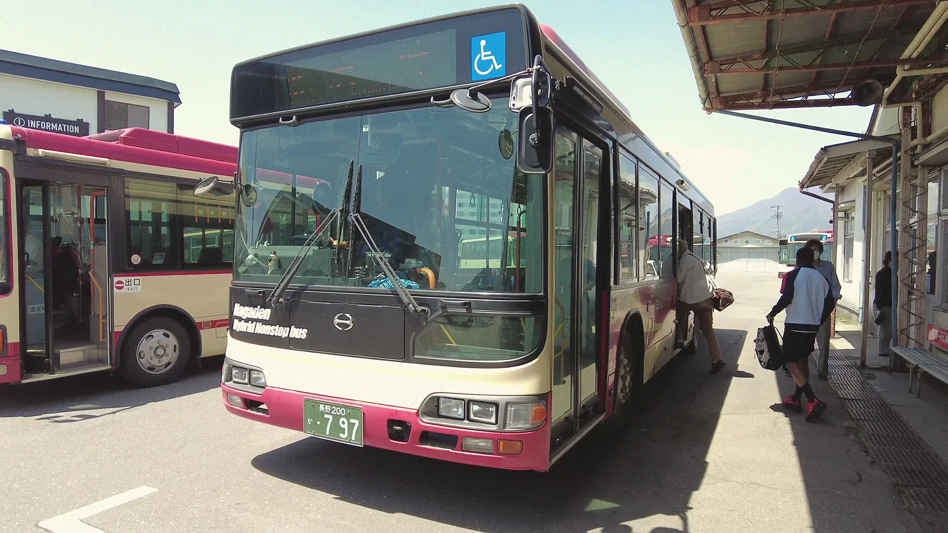 Express bus stopped on a street near Yudanaka Onsen