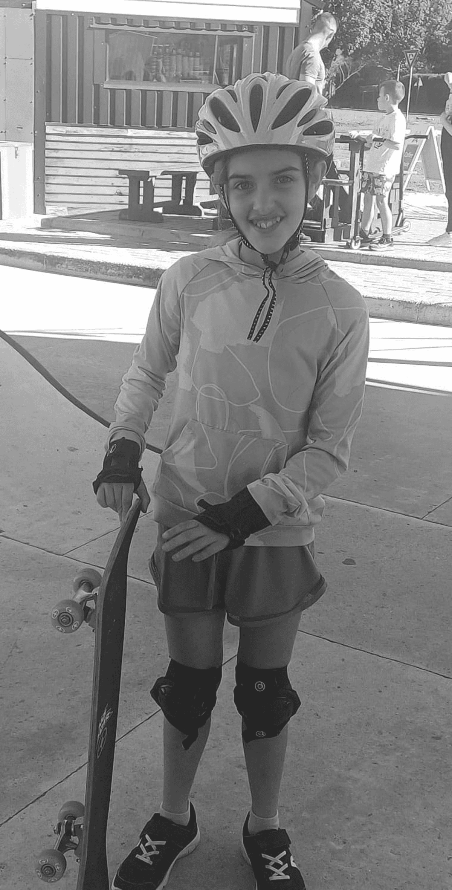 A fast black sports car races down the highway.