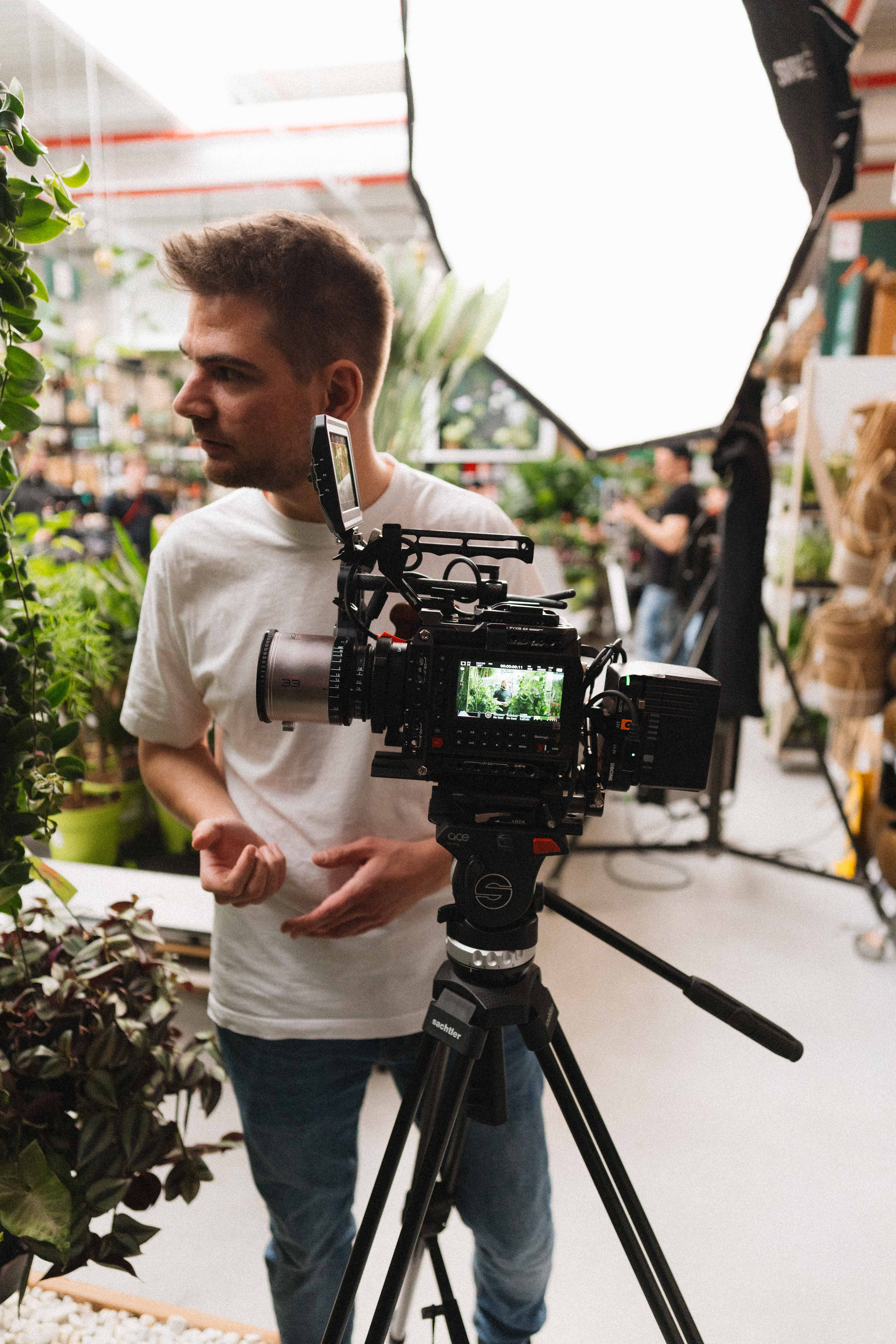 Person sitting on a ledge overlooking New York City skyline