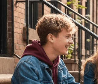 Conversion Truth for Families: Young teenage boy in denim jacket sitting on steps outdoors