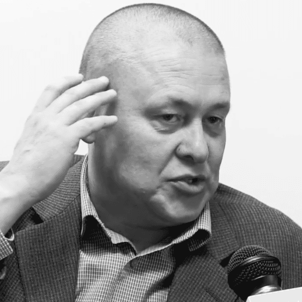 men sitting in front of their laptop computer