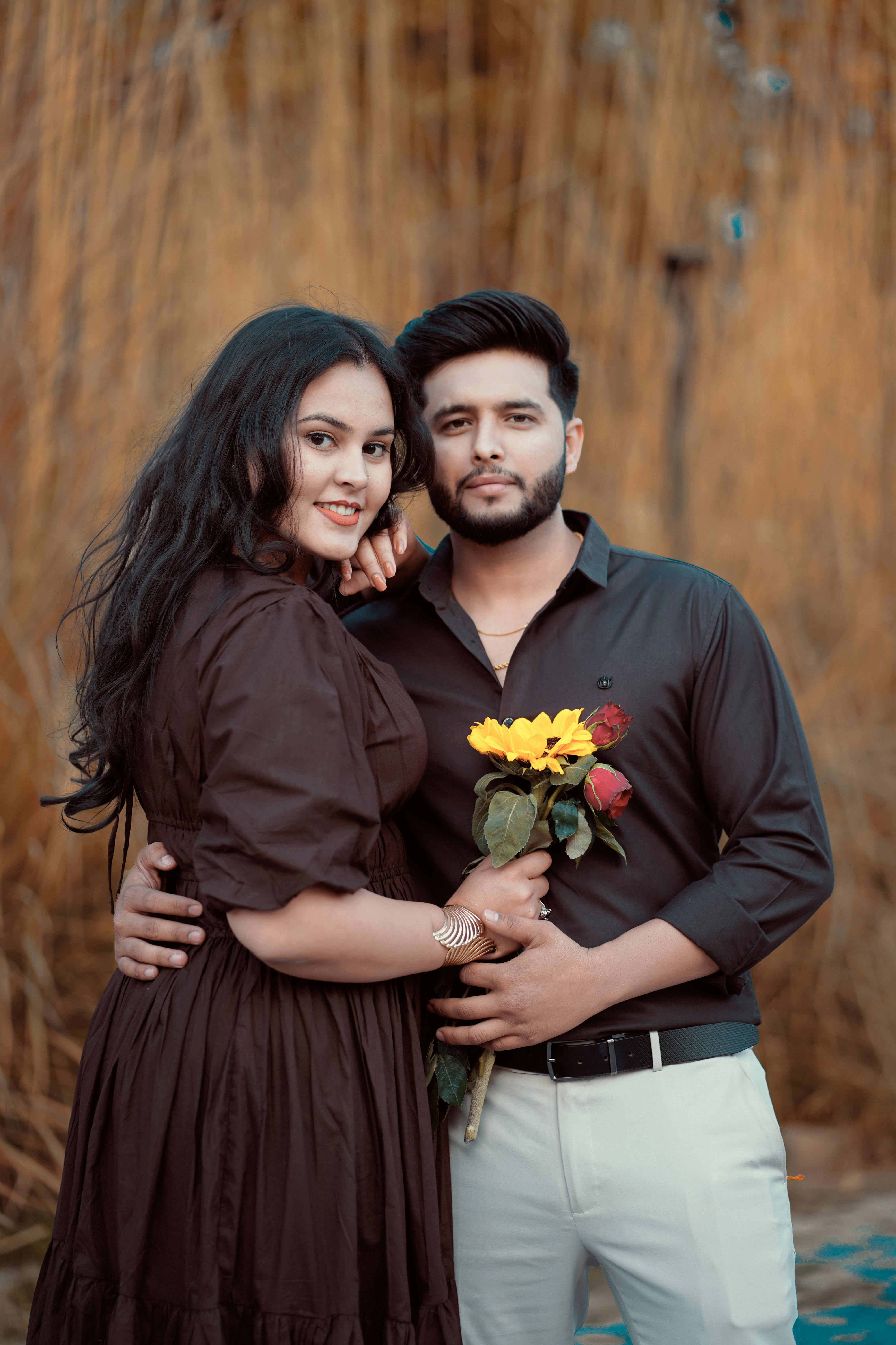 Lovers holding flowers