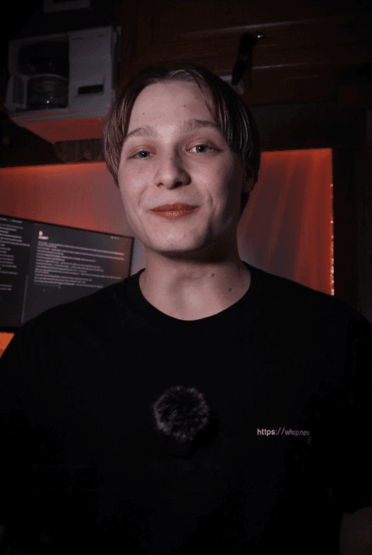 man standing beside wall