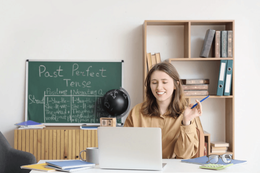 boy in gray sweater beside boy in gray and white plaid dress shirt