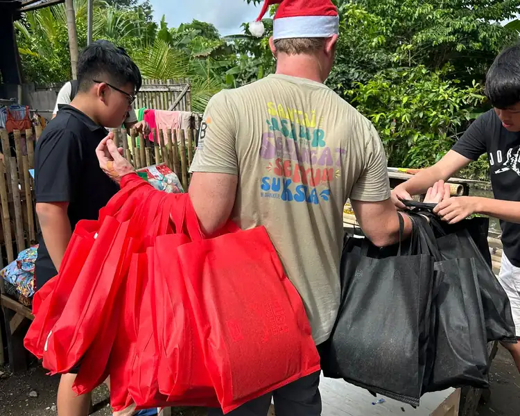 donated food bags to young community members