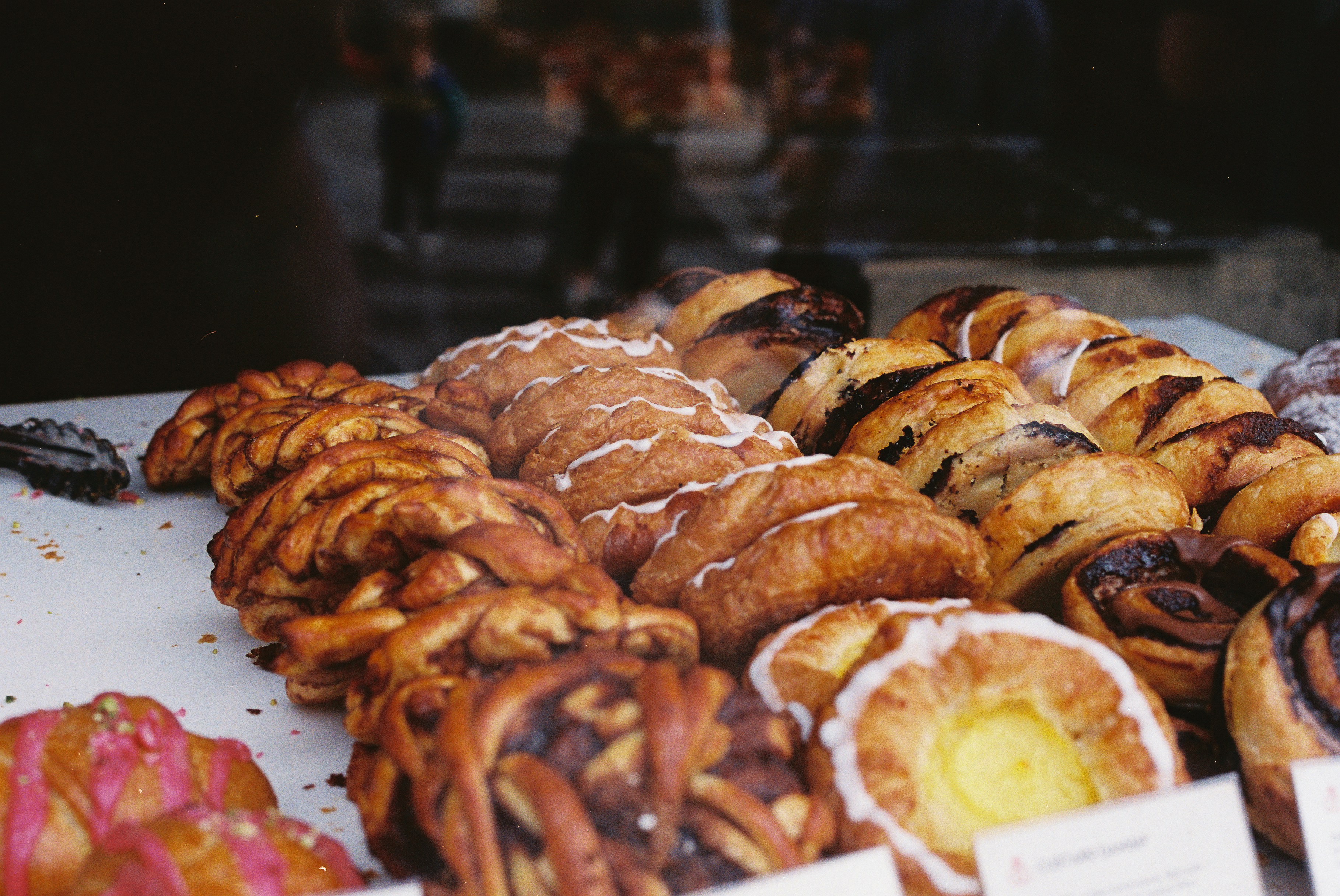 Artisan pastries displayed in a bakery.