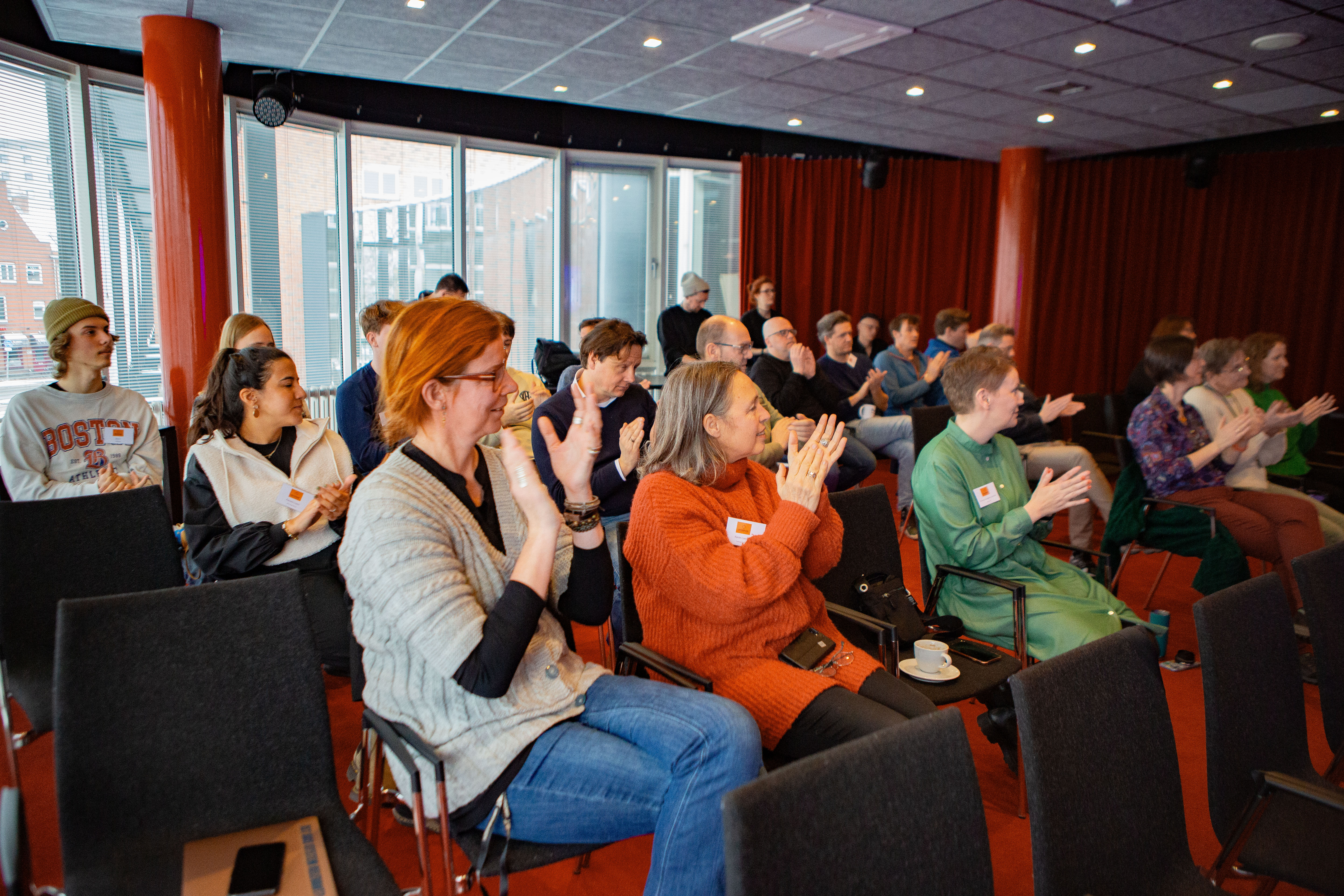 woman sitting around table holding tablet