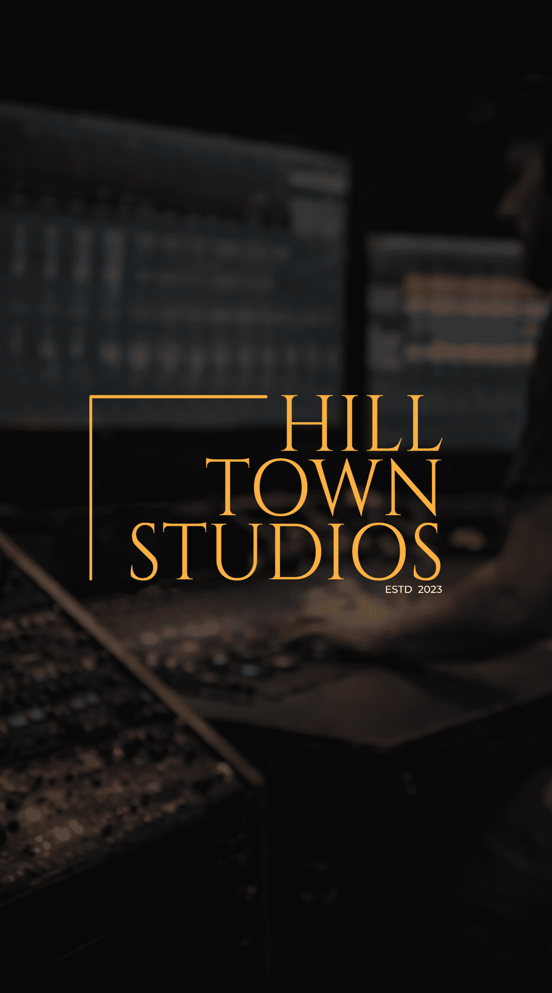 Music producer sitting in his studio