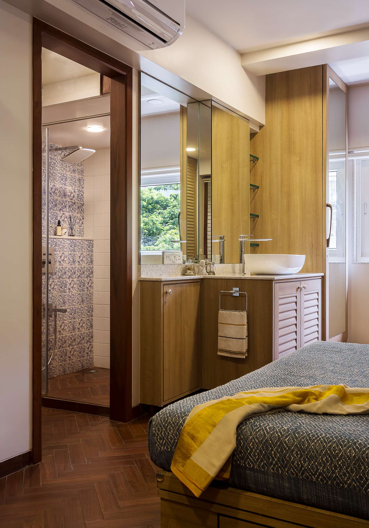 Nature-inspired preschool entrance with sculptural tree partitions and suspended green leaf ceiling panels.