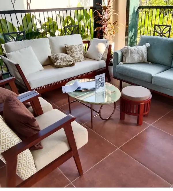 Luxury furniture sofa set featuring a three‑seater sofa and matching wooden armchairs