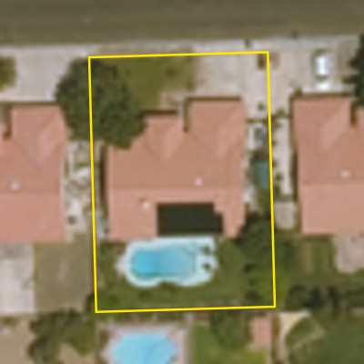 Aerial photo of a backyard pool in Yuma, with the lot outlined in yellow