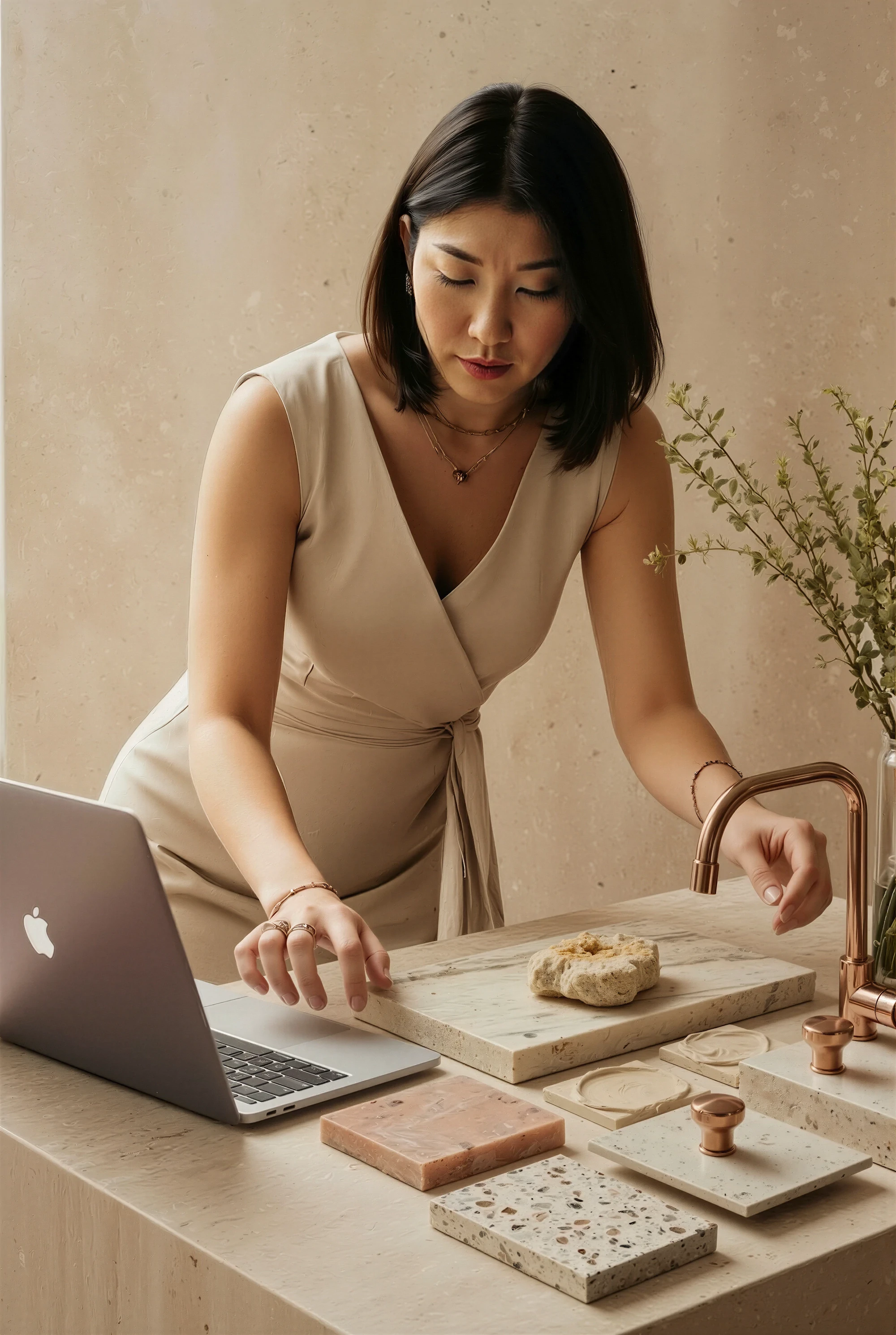 Interior designer reviewing material samples and palettes at a worktable.