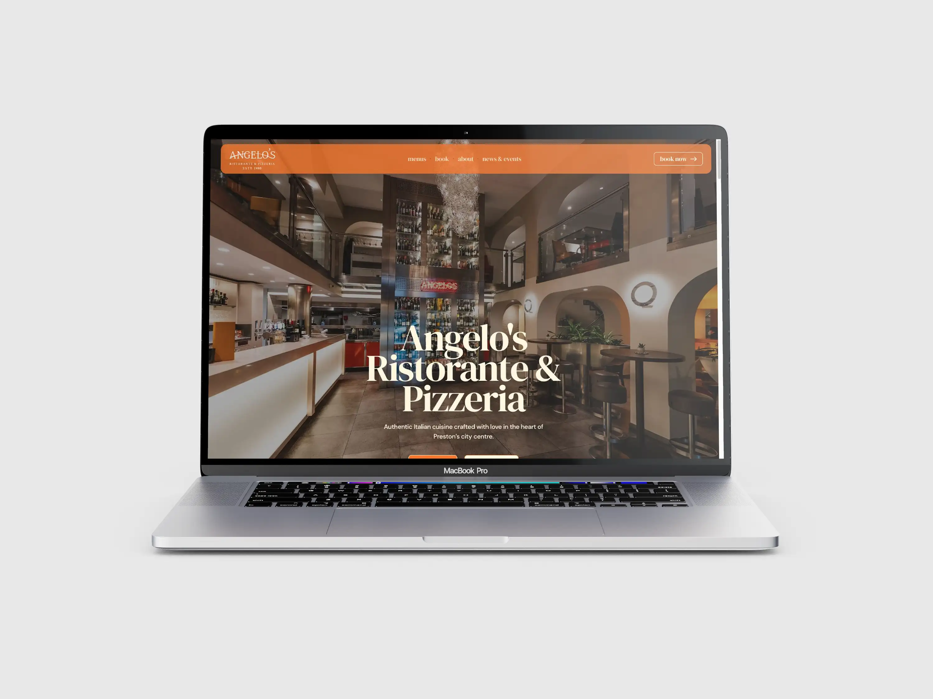 Angelo’s Ristorante & Pizzeria website displayed on a laptop, featuring its restaurant interior.