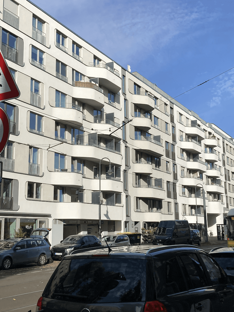 A person stands in a sandstone cave.