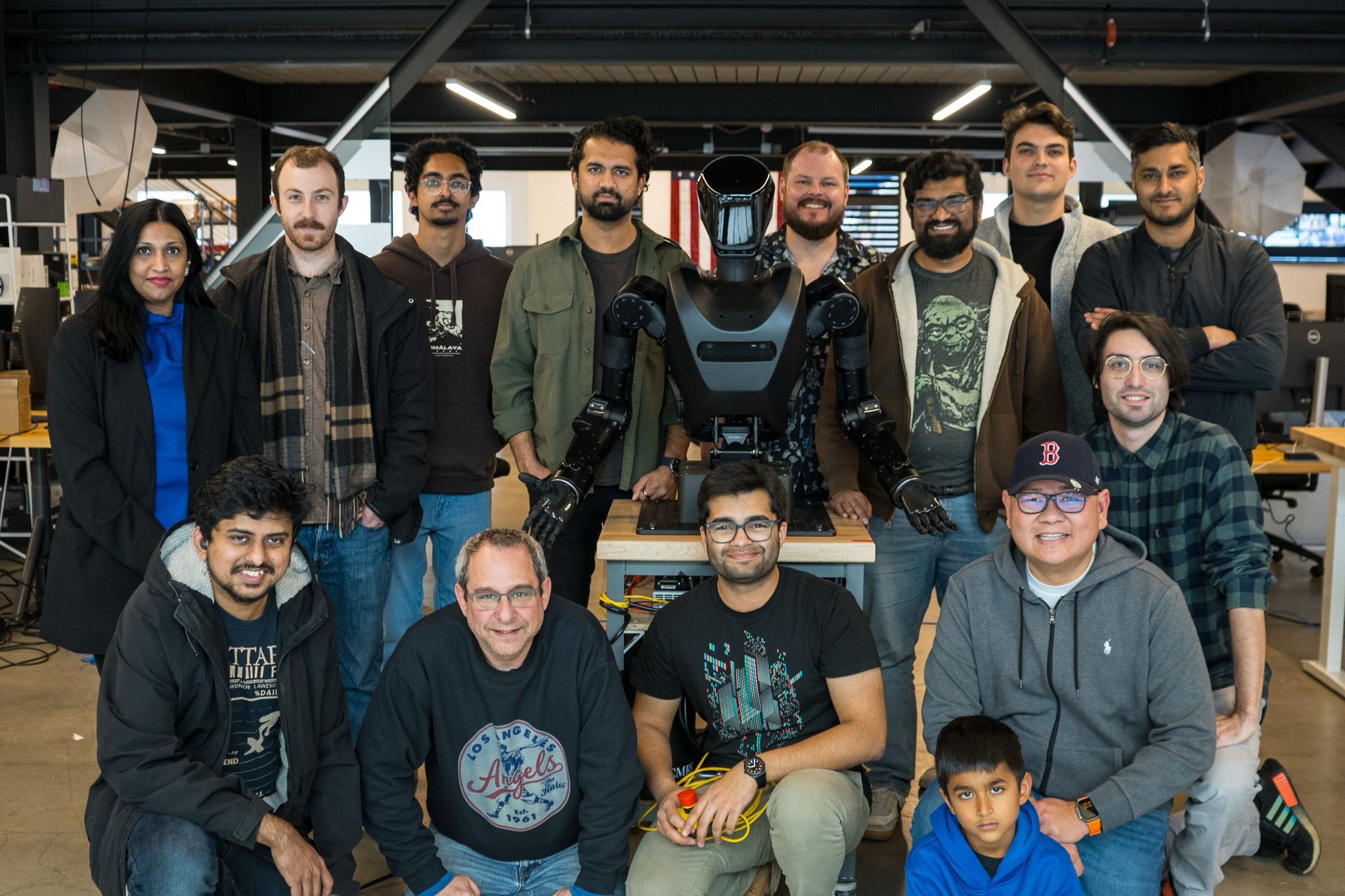 Team collaborating in robotics lab