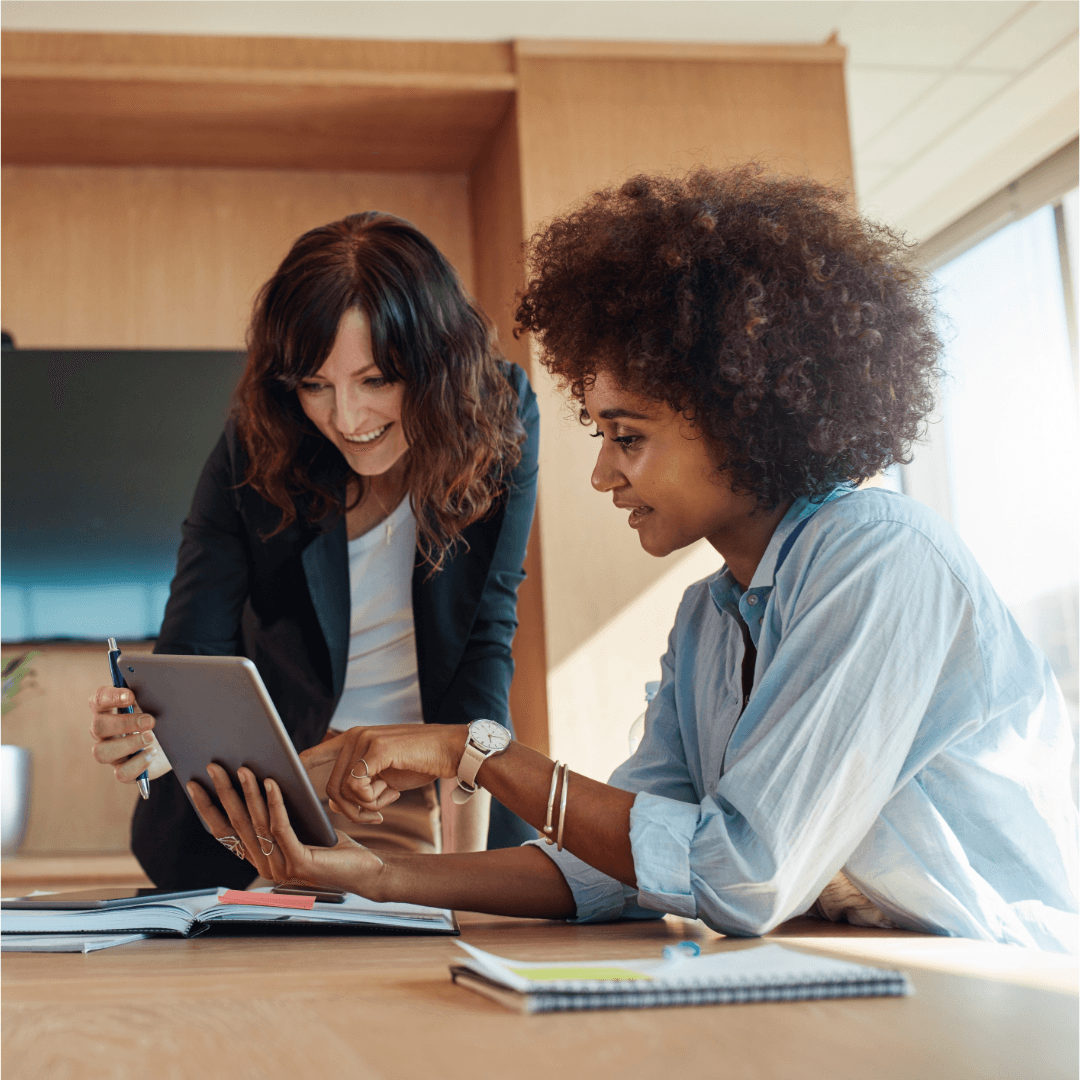 Two professionals discussing AI-powered business tools