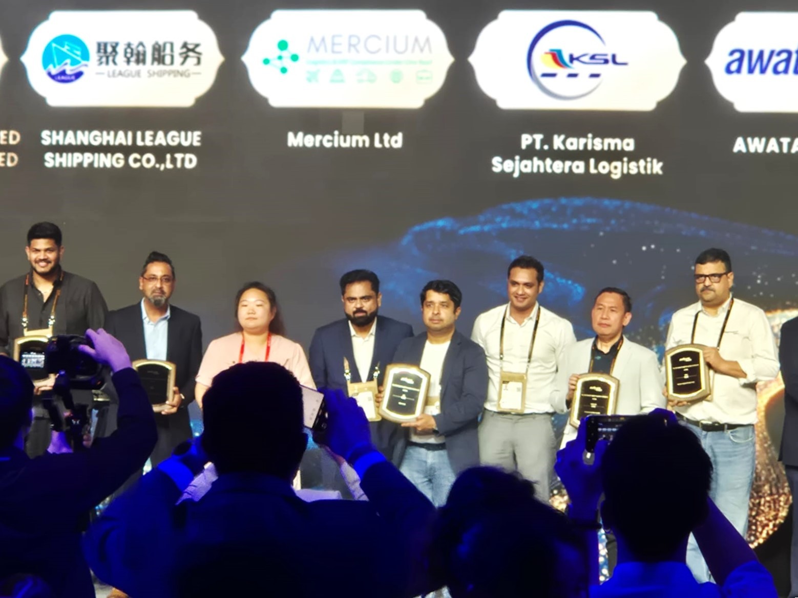 team-receiving-award-on-stage