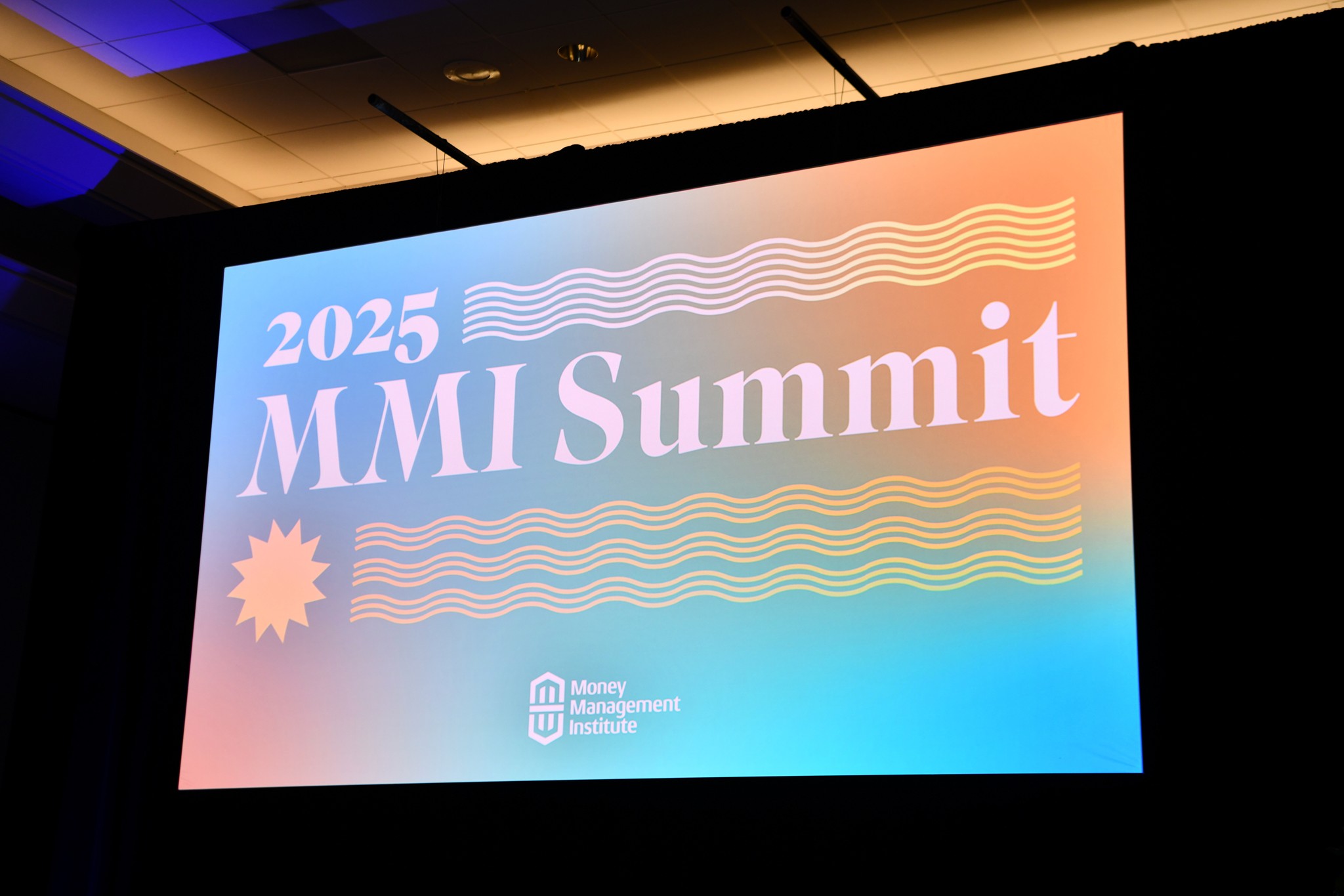 2025 MMI Summit close-up of digital screen with conference branding