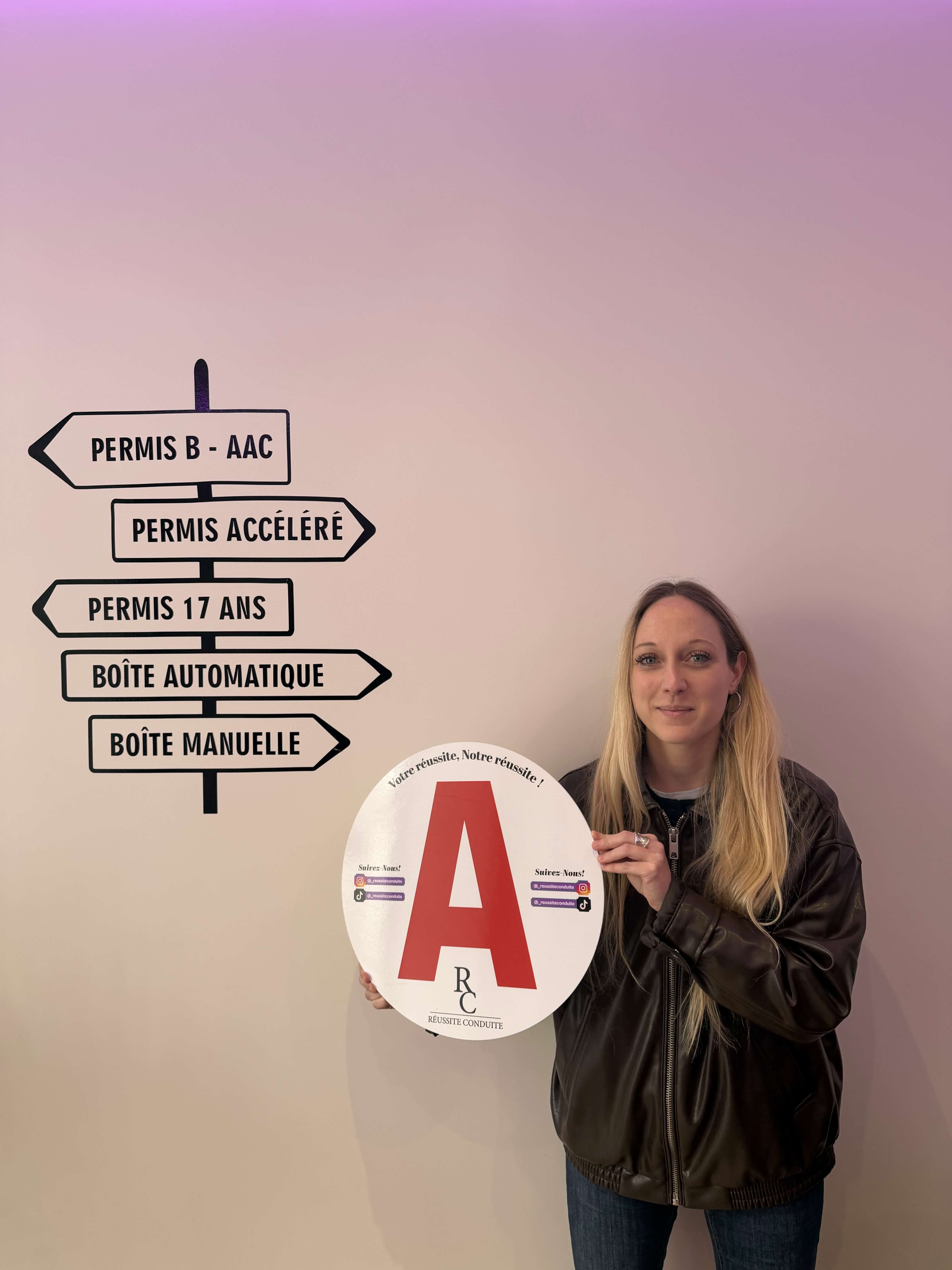 man in black jacket holding blue tablet computer
