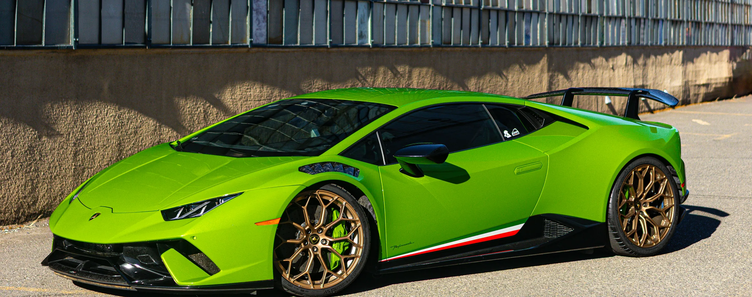 Green Lamborghini Huracán outside 714 Technik in Portland, Oregon