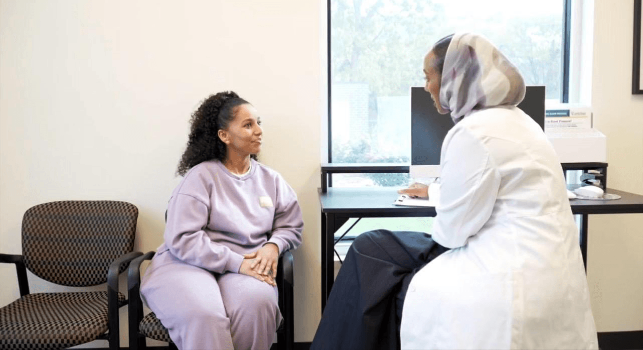 Patient discussing care with her clinician