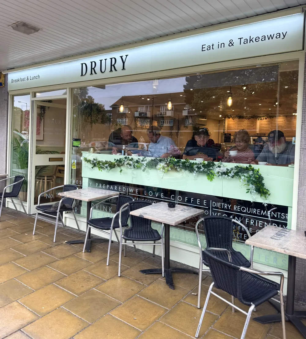 exterior shot of cafe showing tables outside