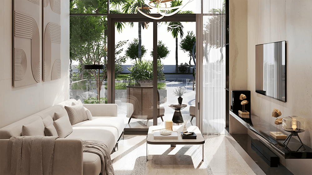 A modern living room featuring a spacious layout and a large glass door leading to an outdoor area.