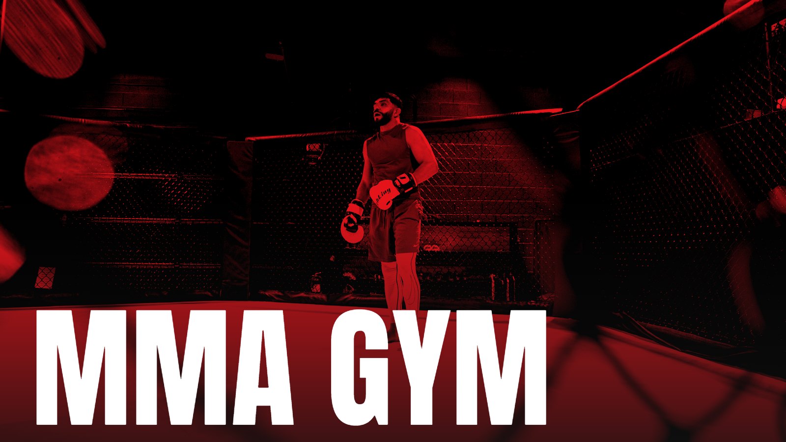 A fighter standing alone in a cage