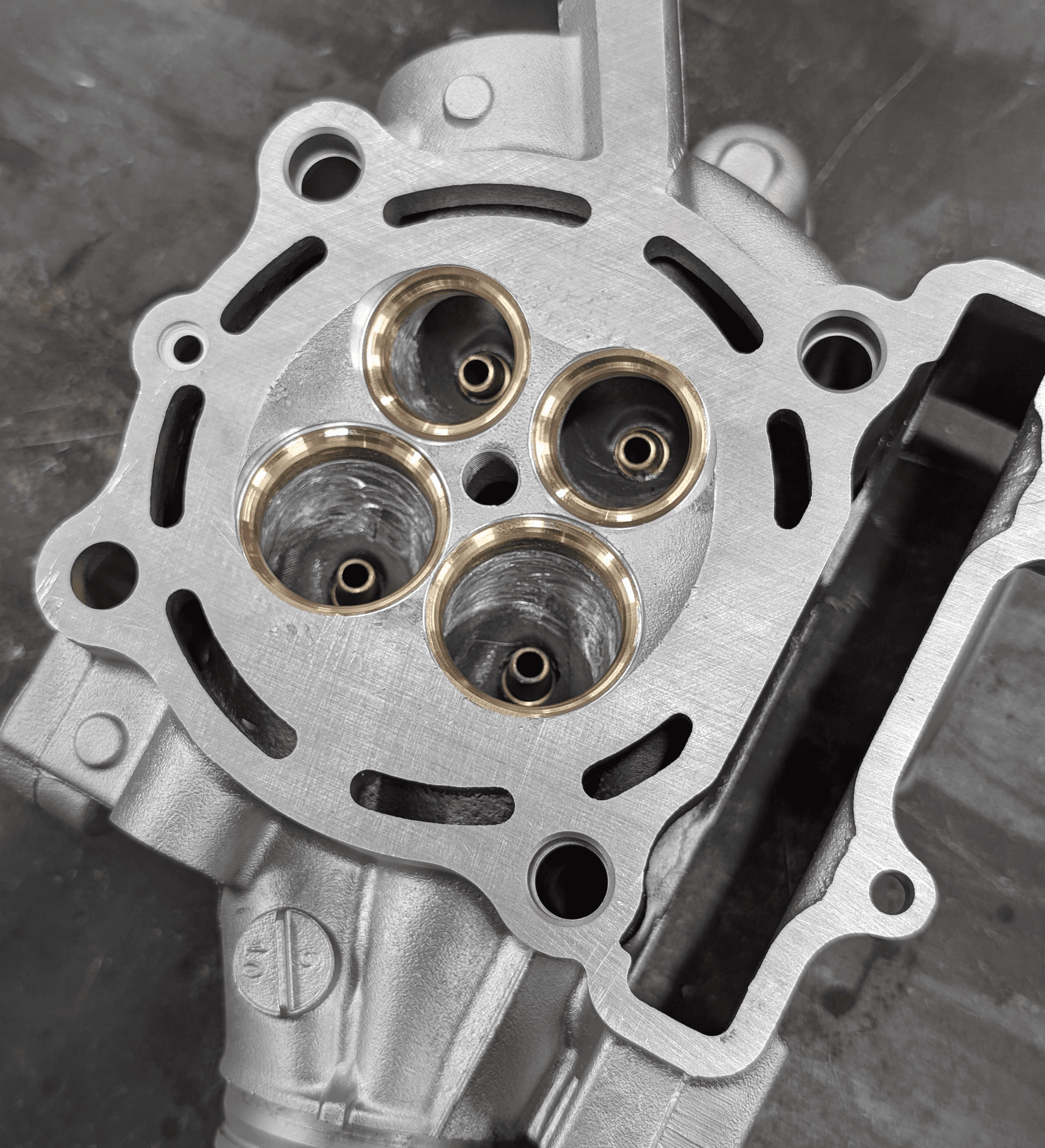 Single cylinder 4-valve cylinder head with new bronze valve guides, new Ni Al bronze valve seats, machined fresh ready for assembly