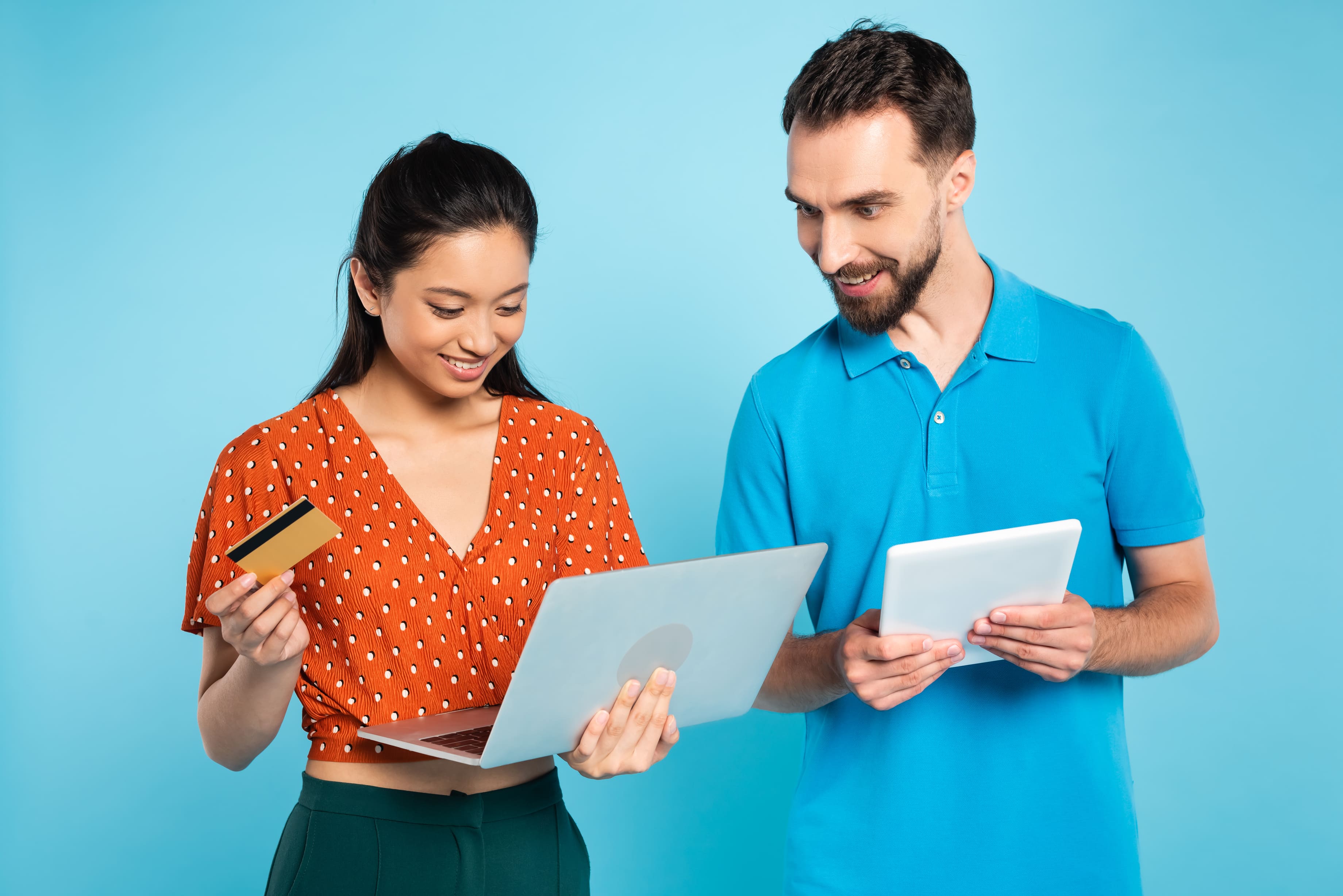 two persons looking at the laptop screen