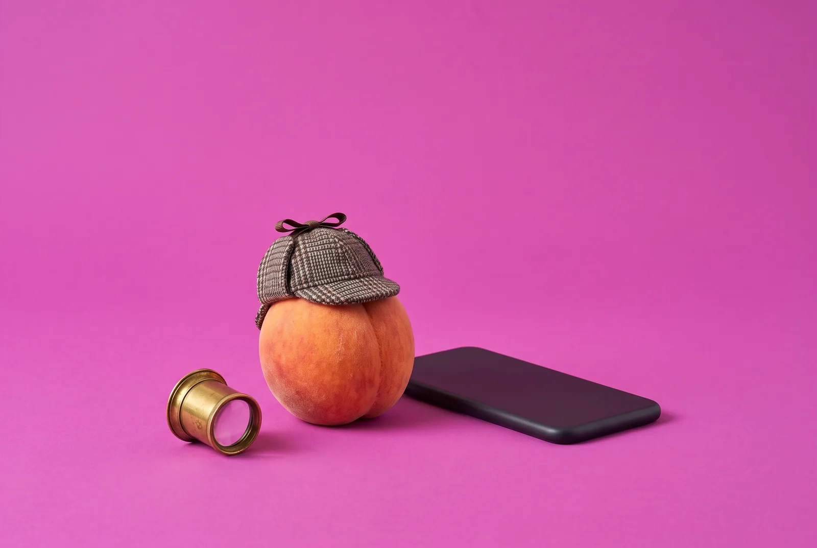 A peach in a detective hat beside a face-down phone, why snooping backfires when your boyfriend watches porn