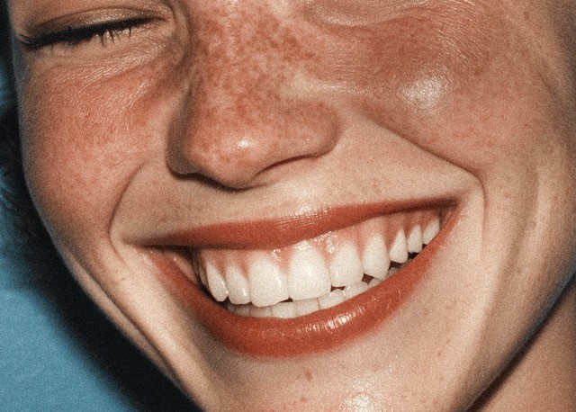 White woman smiling close up
