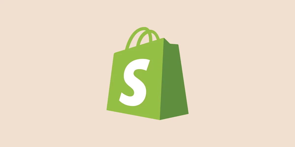 Shopify logo green shopping bag icon with white "S" on a beige background | IDIGIU