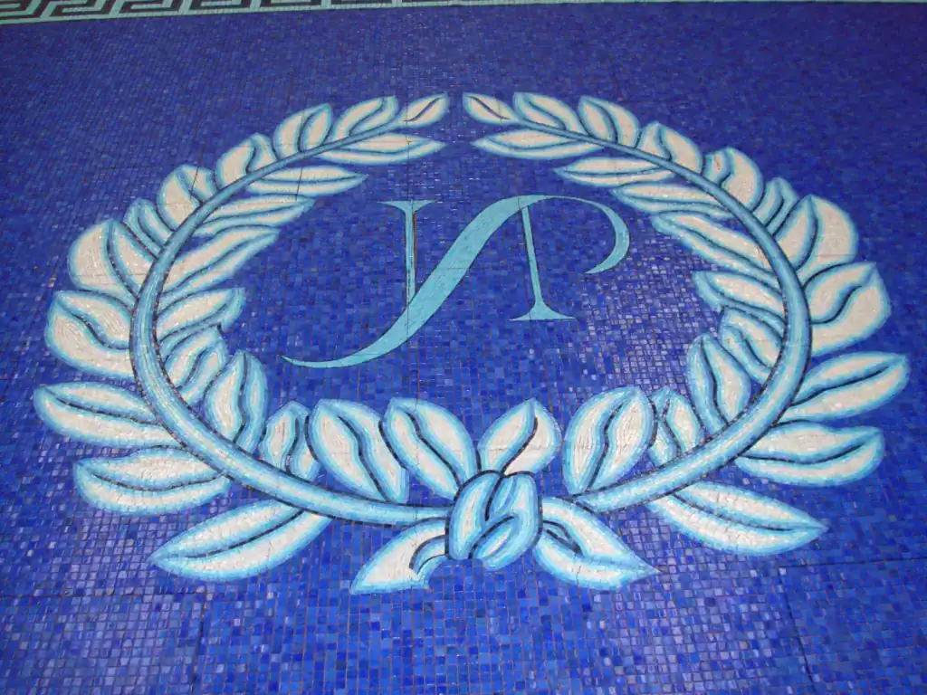 Greek style pool mosaic with a decorative key border and Roman-inspired motifs. Perfect for enhancin.