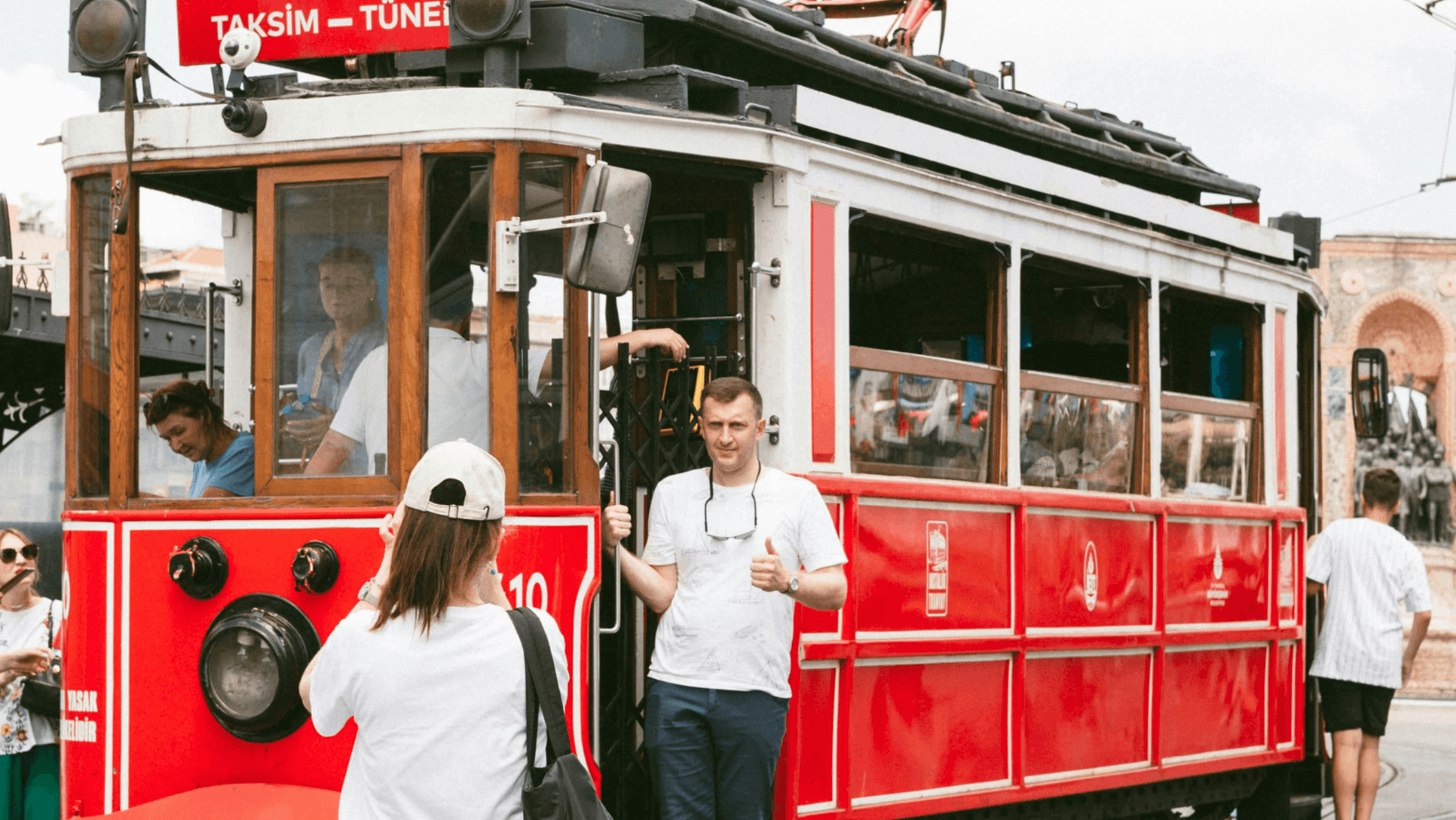 Historic tram on Istiklal Street in Istanbul, Türkiye with tourists