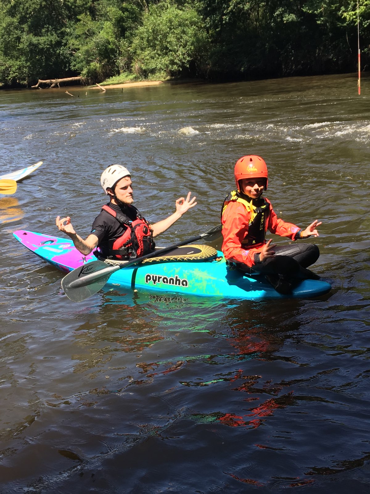 Group of men standing with Sufboard