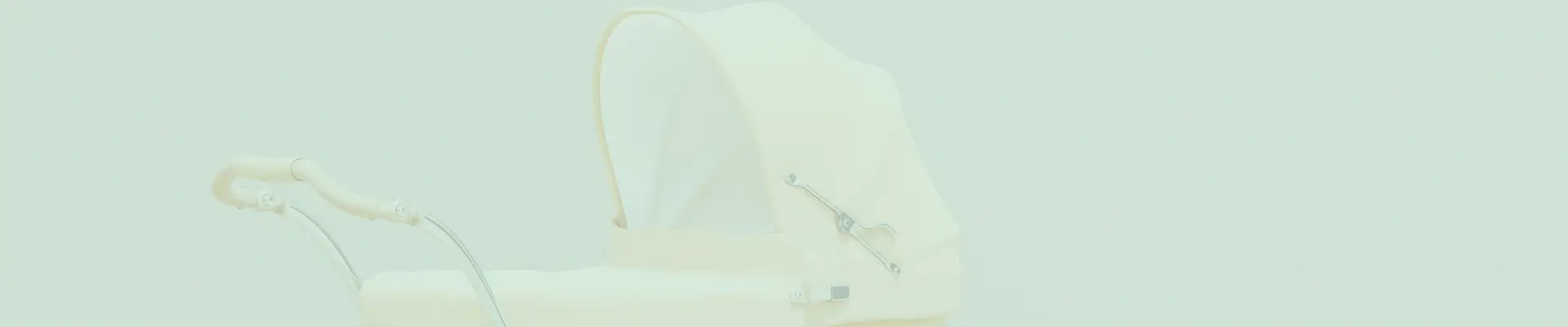 Side view of a vintage-style cream baby stroller with a curved handle and canopy, perfect for newborn transportation.
