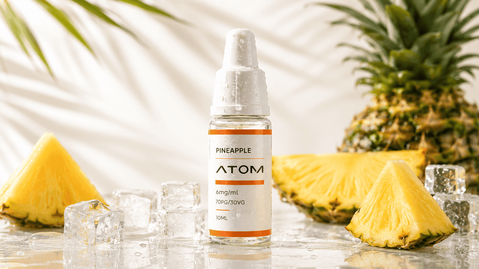 ATOM Pineapple e-liquid bottle with fresh pineapple slices and ice cubes in a bright tropical product setting.
