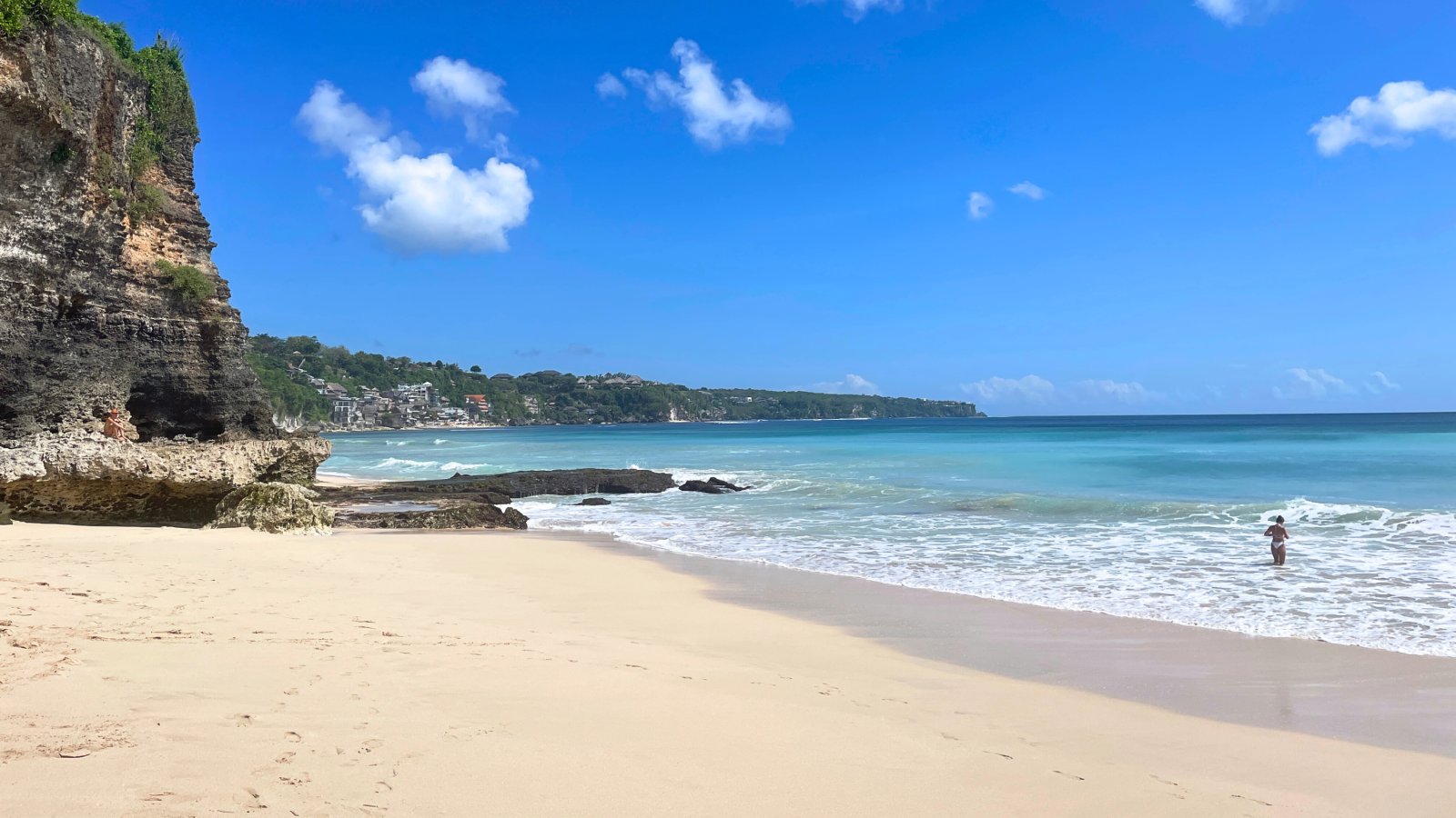 brown and white temple surrounded by green trees during daytime