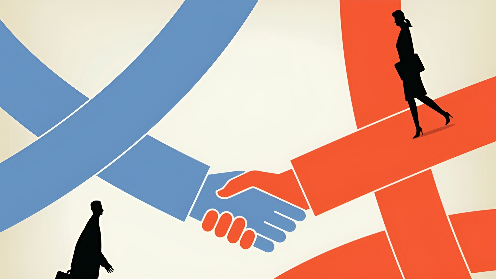 A person wearing glasses and a dark sweater sits at a desk, smiling and giving a thumbs up, with a laptop open in front of them, and a framed abstract painting hanging on the wall behind.