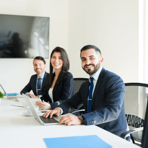 a woman sitting at a table with a piece of paper in front of her