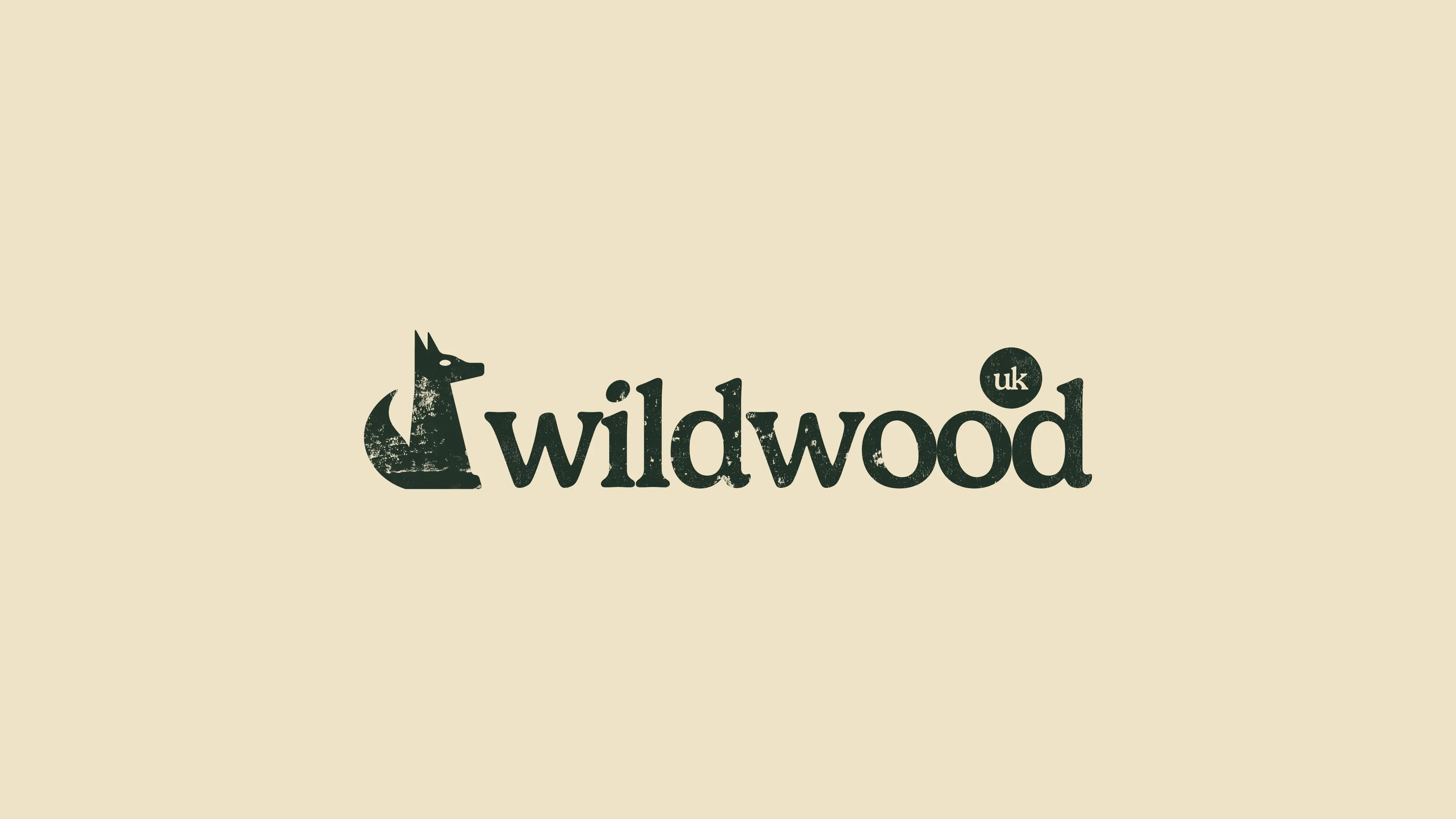 Logo of "Wildwood" featuring a stylized representation of nature and text in green against a light beige background.