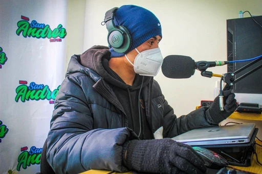 A tree floating on top of an island at night