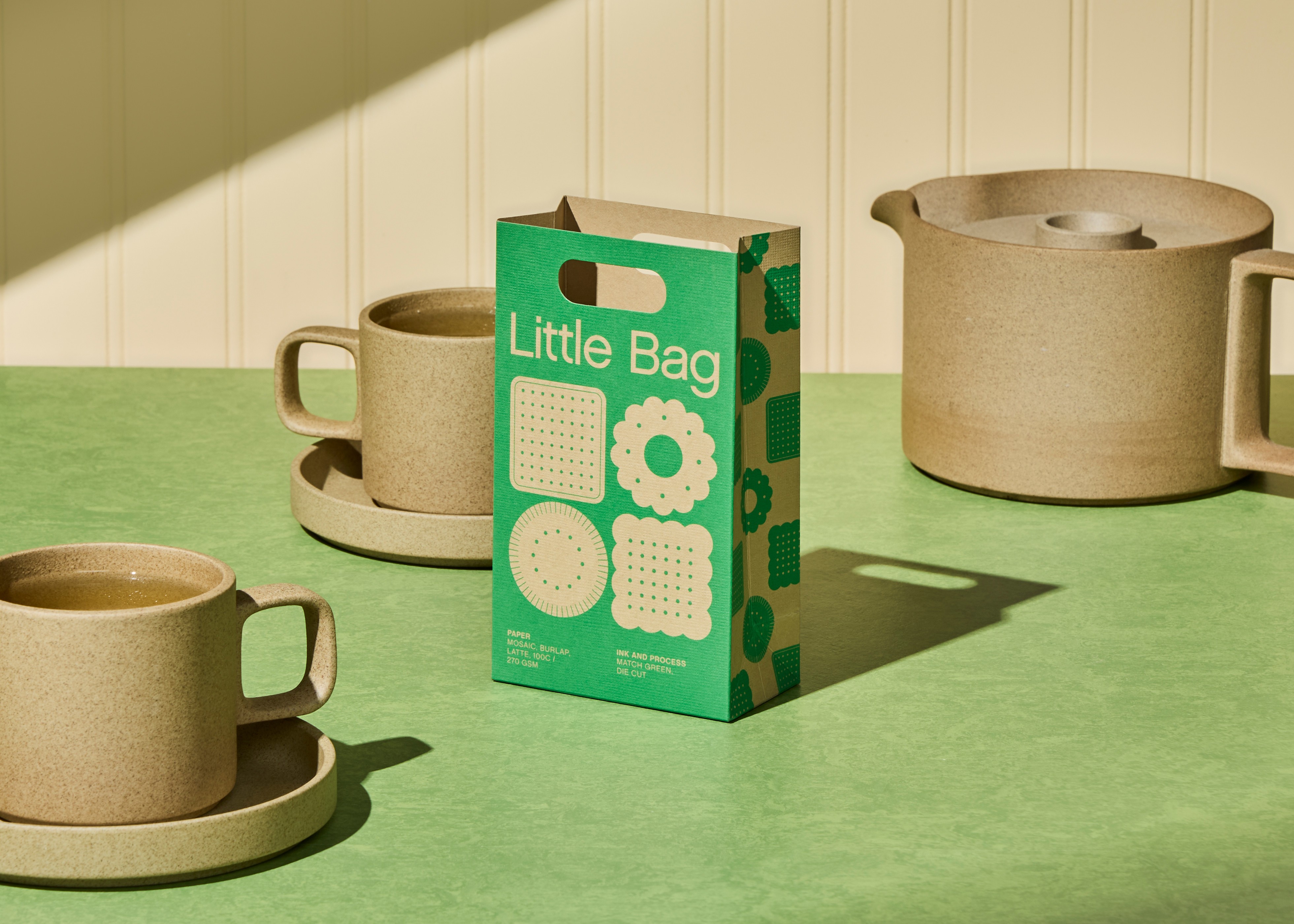 Streetside billboard with flyposters of the Batch.Works brand and illustrations